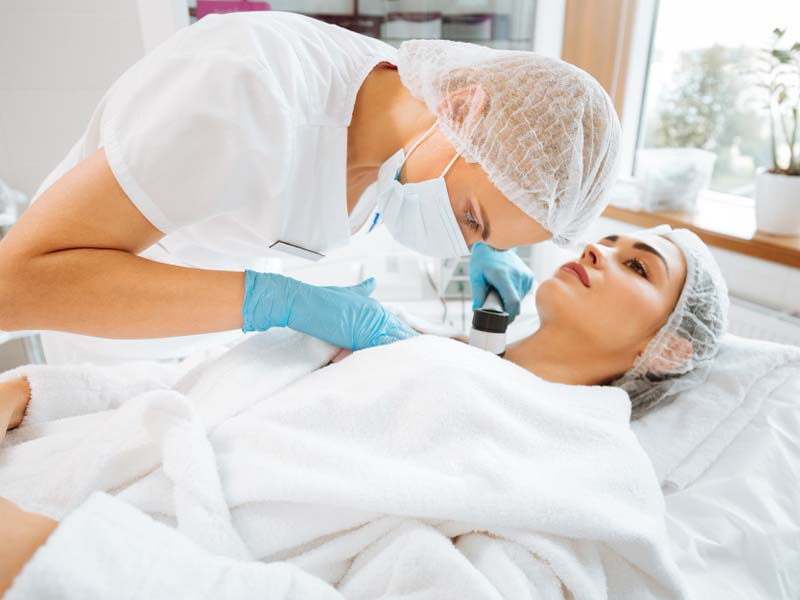 Dermatologist using Dermoscope